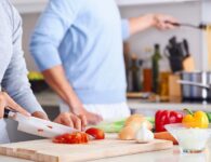 couple cooking healthy food for diet