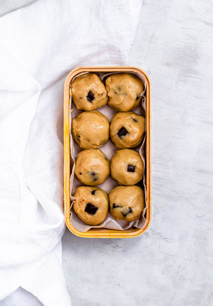 Cashew cookie dough balls in container