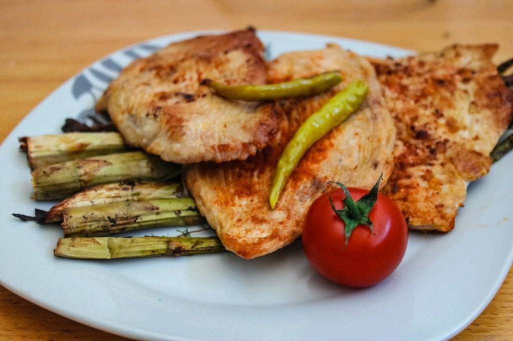 grilled cage-free chicken on a plate