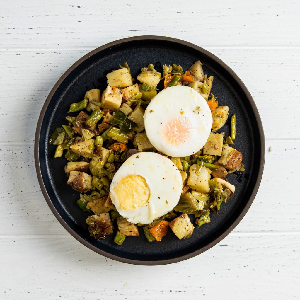 plate of hardboiled eggs over vegetables