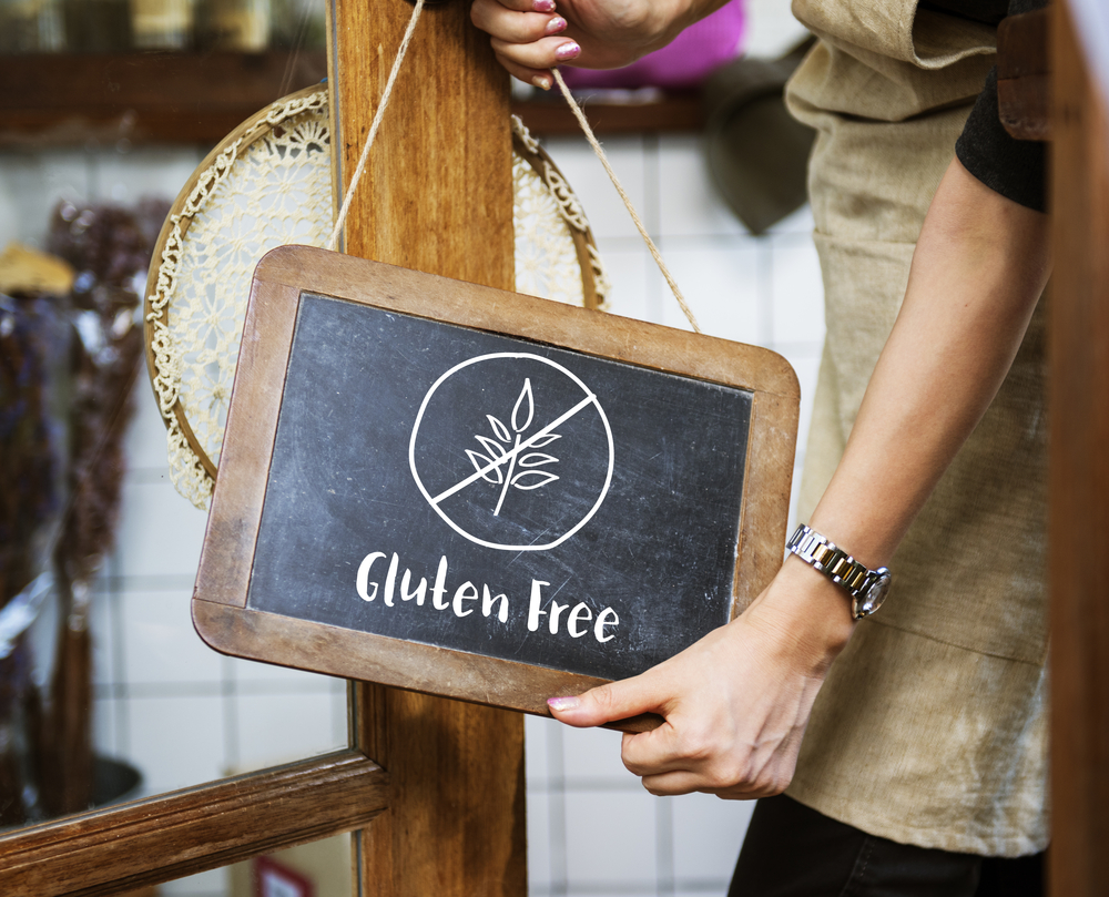 gluten-free sign being hung